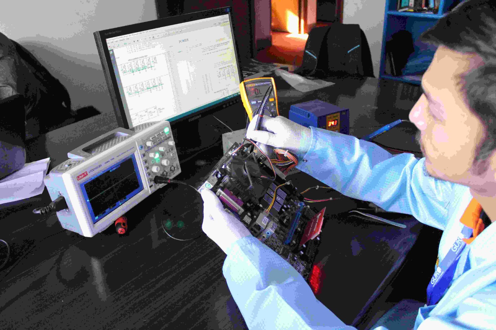 Technician cleaning a laptop